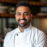 Amir Patel, wearing chef attire