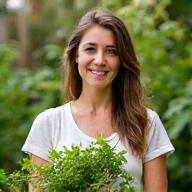 Fiona Macleod, standing outdoors with fresh produce