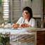 Priya at her desk with healthy lunch
